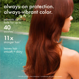 Woman with long reddish-brown hair. Overlaid text reads: "always-on protection. always-vibrant color. Prevents color fade for up to 40 washes. 11x stronger hair. Leaves hair smooth + shiny."