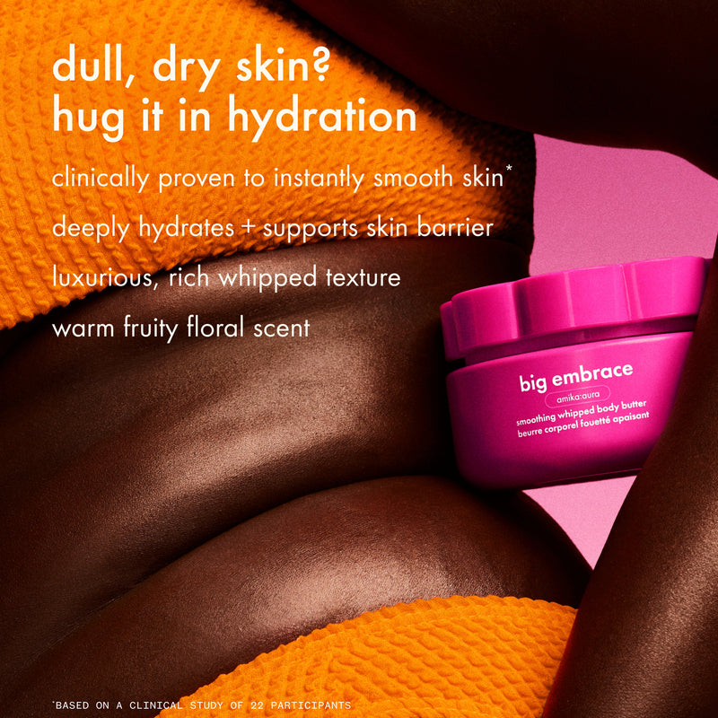 a close-up image shows moisturized skin with big embrace body butter on a pink background. text reads “dull, dry skin? hug it in hydration” and lists benefits including clinically proven instant smoothing, deep hydration that supports the skin barrier, a luxurious whipped texture, and a warm fruity floral scent.