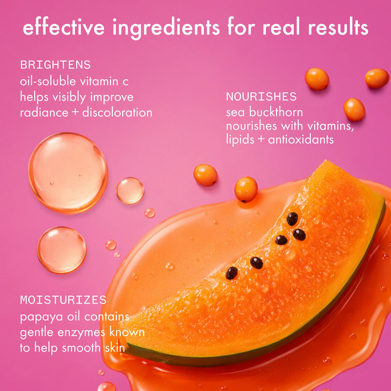 Papaya slice with oil droplets on a pink background, highlighting effective ingredients for skin care.