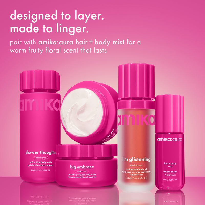 Amika beauty product lineup on a pink background with text about scents and layering.