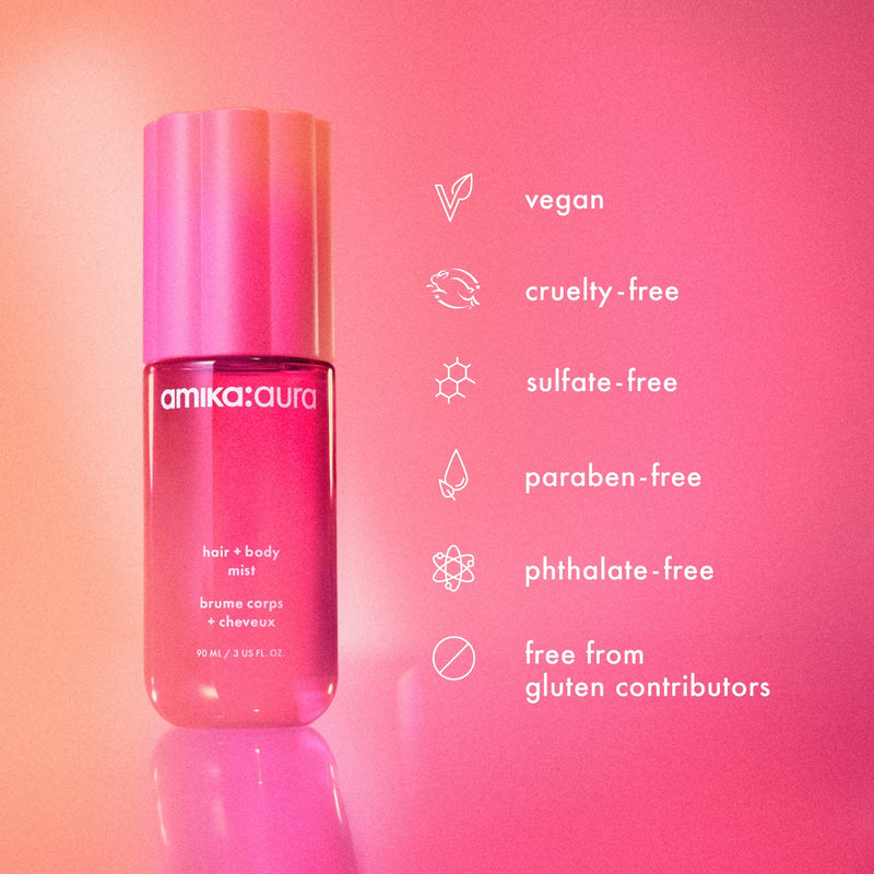 a bottle of amika:aura hair + body mist against a pink background. amika:aura is: vegan, cruelty-free, sulfate-free, paraben-free, phthalate-free and is free from gluten contributors. 