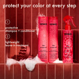 Three red bottles (shampoo, conditioner, treatment spray) with foam on red tiled background. Text: "protect your color at every step" with two-step system labeled.